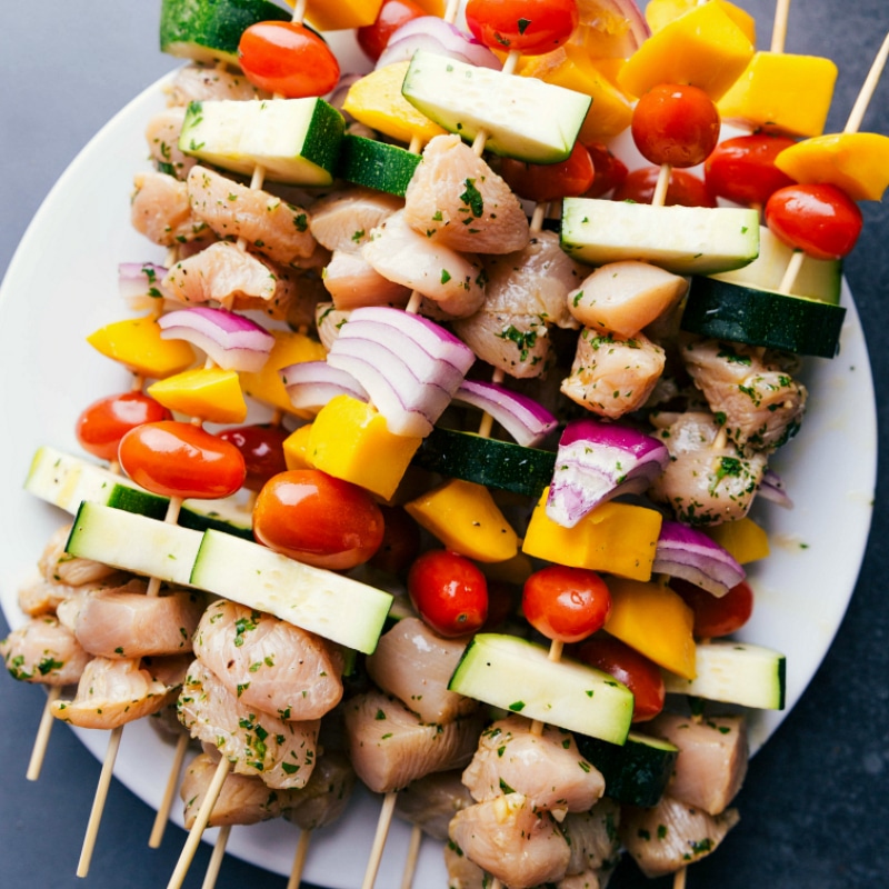 Preparing Chicken Kabobs for Grilling Uncooked chicken kabobs recipe, prepared and ready for grilling.