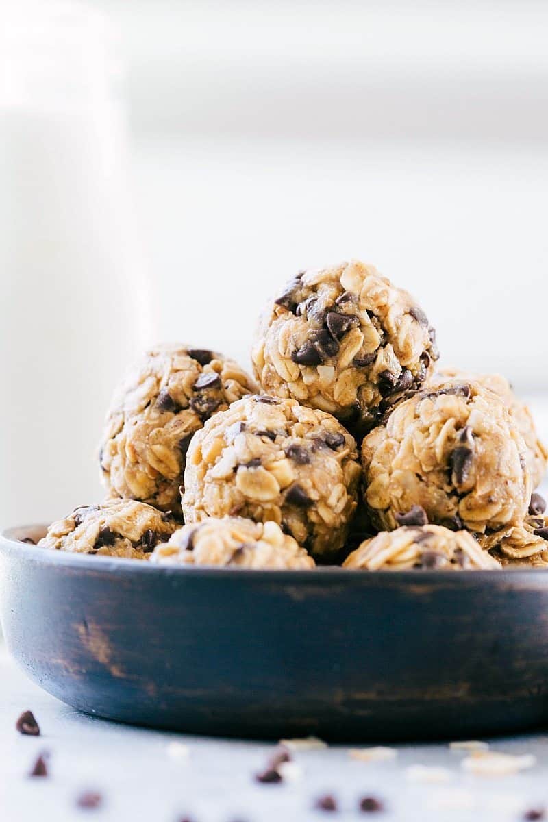 Easy, protein-packed, granola balls -- these Energy Bites make the perfect snack or breakfast on-the-go (no baking required!). Recipe via ChelseasMessyApron.com #granola #oats #energybites #chocolate #protein #energy Image of the energy bites stacked together in a bowl
