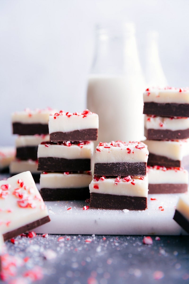 Easy and rich Peppermint Fudge Peppermint Fudge, cut into squares and stacked on top of each other.