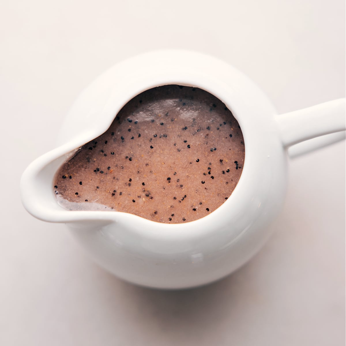 Delicious Poppyseed Dressing The poppyseed dressing used in this Turkey Cranberry Salad in a dressing dispenser.