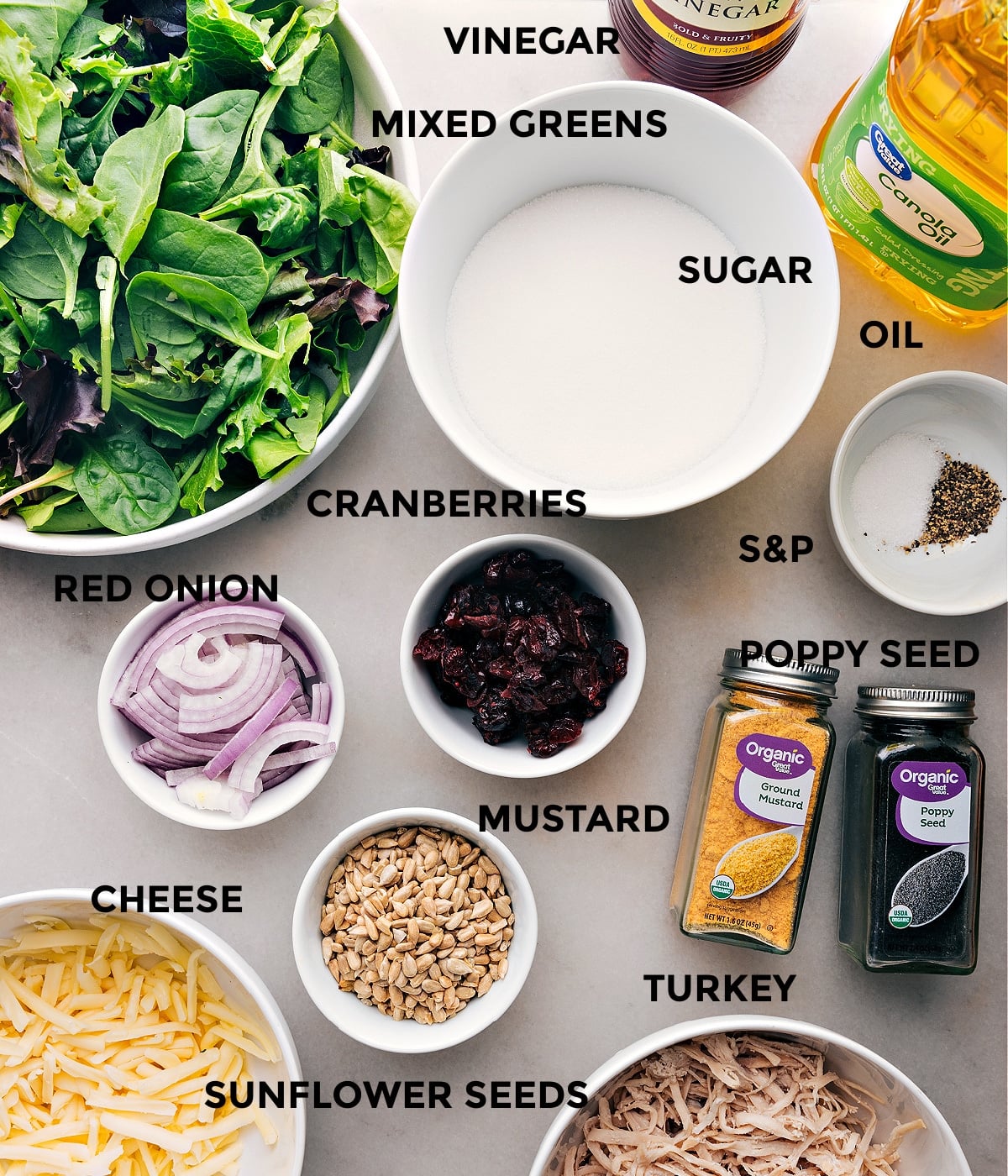 Delicious Ingredients In Turkey Cranberry Salad All the ingredients and dressing used in this dish displayed out to prep.