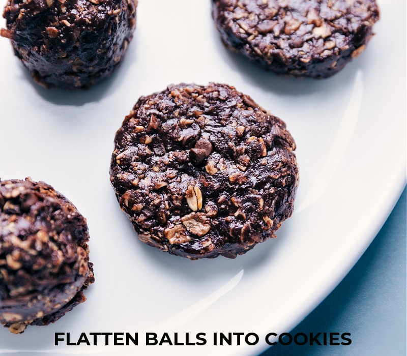 Chocolate-Peanut Butter Breakfast Cookies are loaded with delicious and satiating ingredients! Recipe via ChelseasMessyApron #dessert #healthier #quick #easy #simple #best #chocolate #peanutbutter #breakfast #cookies Chocolate-Peanut Butter Breakfast Cookies being flattened into cookies