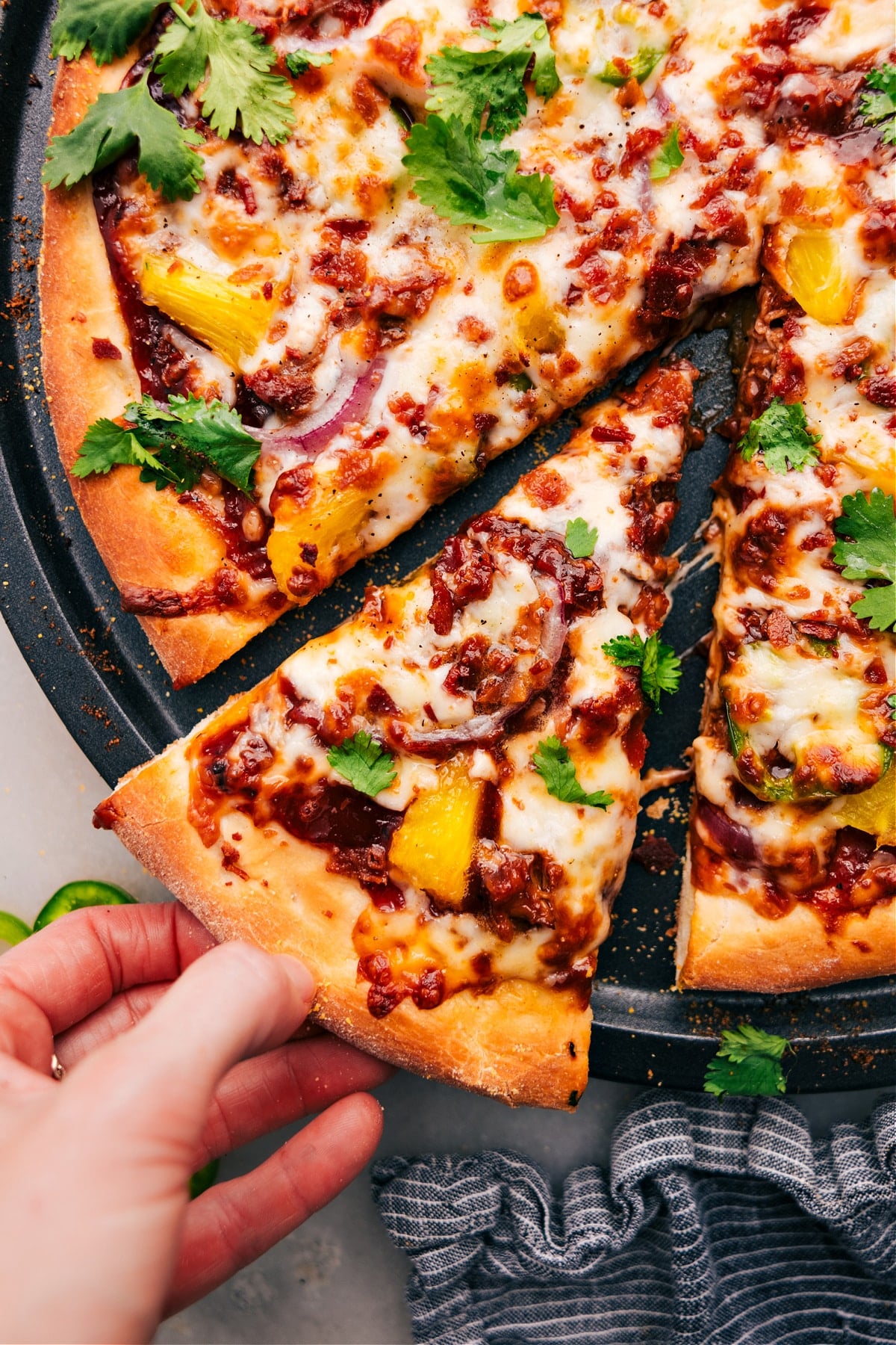 The Best BBQ Chicken Pizza Recipe BBQ Chicken Pizza Recipe sliced up ready to be enjoyed.