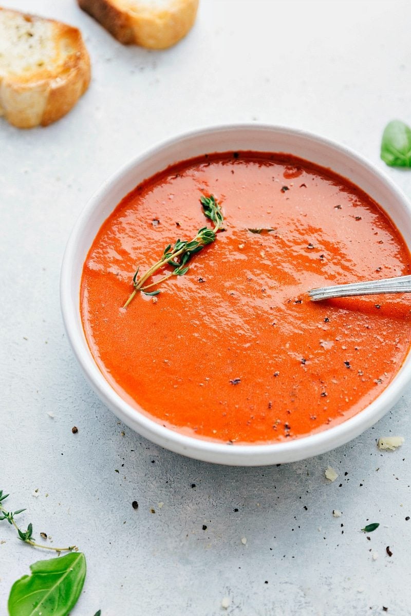 Tomato Basil Soup Tomato Basil Soup recipe in a bowl with fresh thyme.