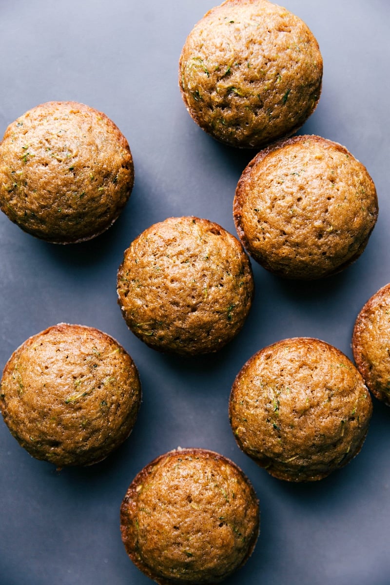 Healthy Zucchini Muffins - Golden Brown Delight The finished healthy breakfast or dessert, fresh out of the oven, baked to a golden brown perfection.