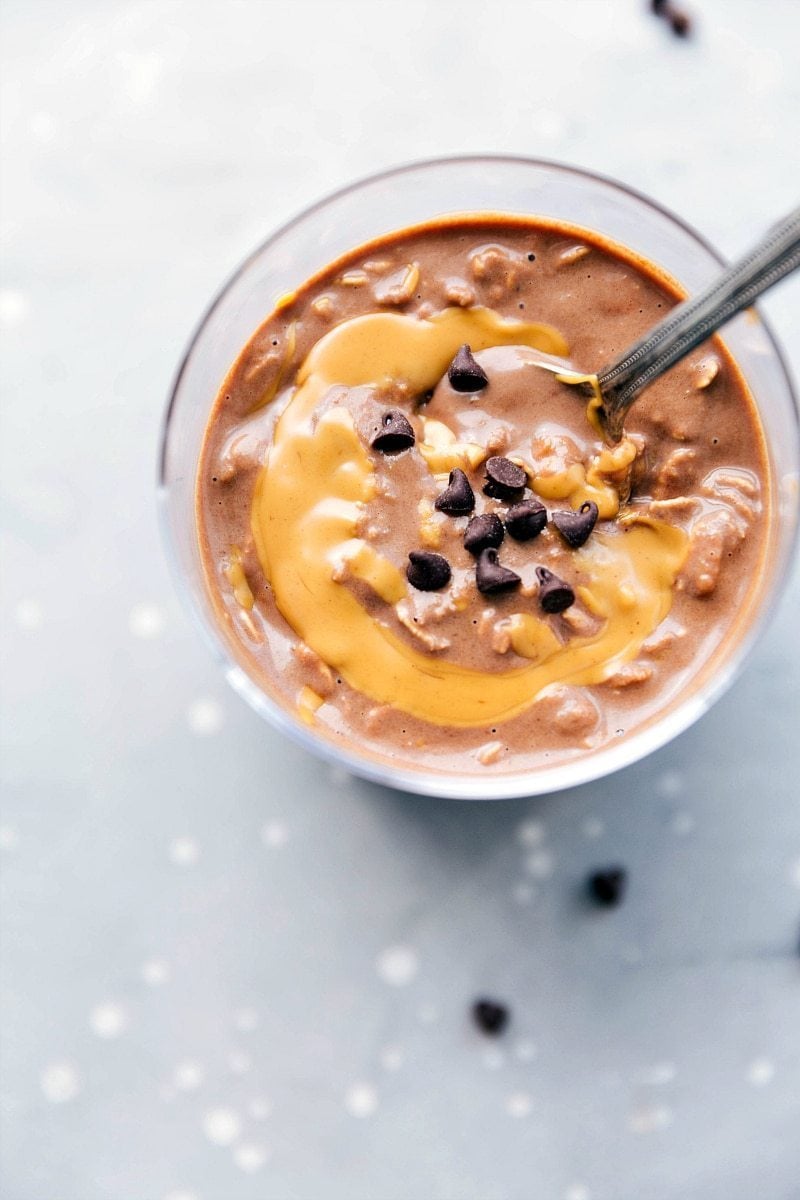 On-the-Go Peanut Butter Overnight Oats with Swirl and Chocolate Chips Topping Peanut butter overnight oats, ready to be enjoyed on the go, with a peanut butter swirl mixed in and topped with chocolate chips.