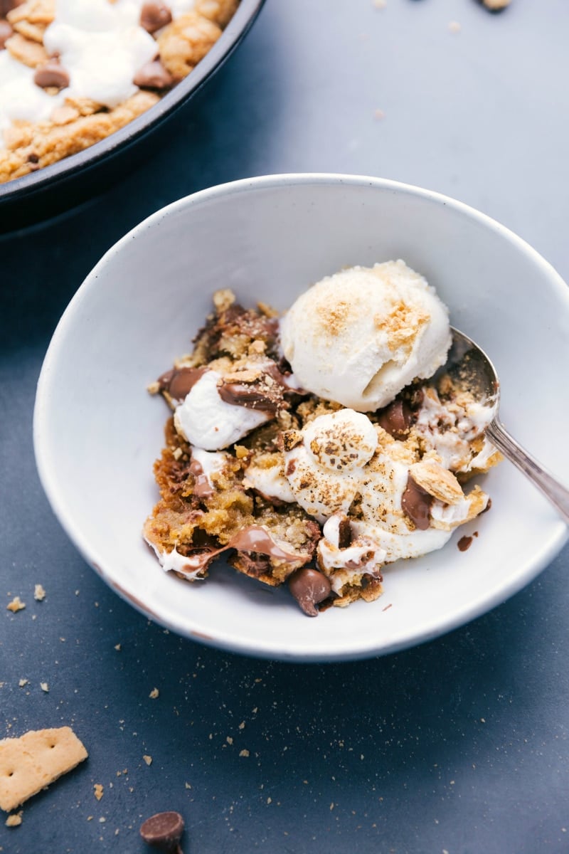 Perfect Dessert Duo: S'mores Pizookie with Ice Cream in a Bowl S'mores pizookie in a bowl, topped with ice cream, a perfect blend of warm cookie and cold ice cream.