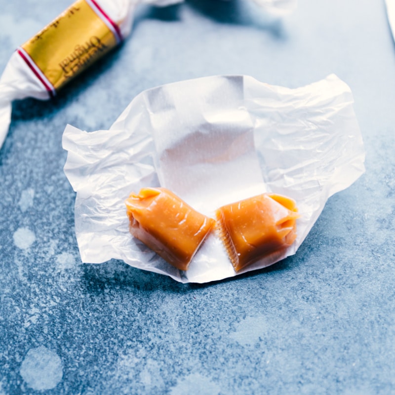 Big, soft and chewy, Caramel Stuffed Cookies! Plus all the tips and tricks you need to make these taste (and look) like they're straight from a bakery! Recipe via ChelseasMessyApron #dessert #m&m #treat #best #quick #easy #simple #caramel #stuffed #cookies Process shot--the caramel cut in half