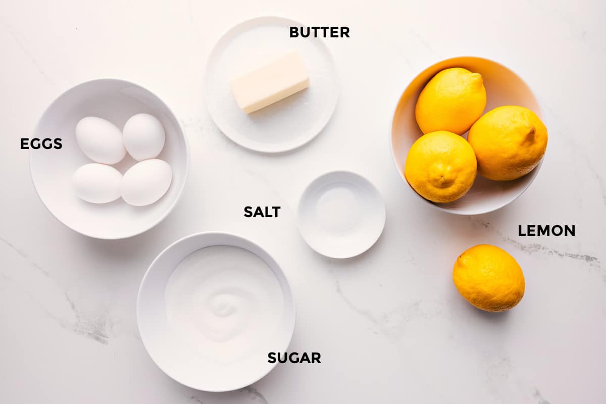 Ingredients In This Lemon Curd Recipe All the ingredients in this recipe prepped out for easy assembly including the eggs, butter, sugar, salt, and lemons.