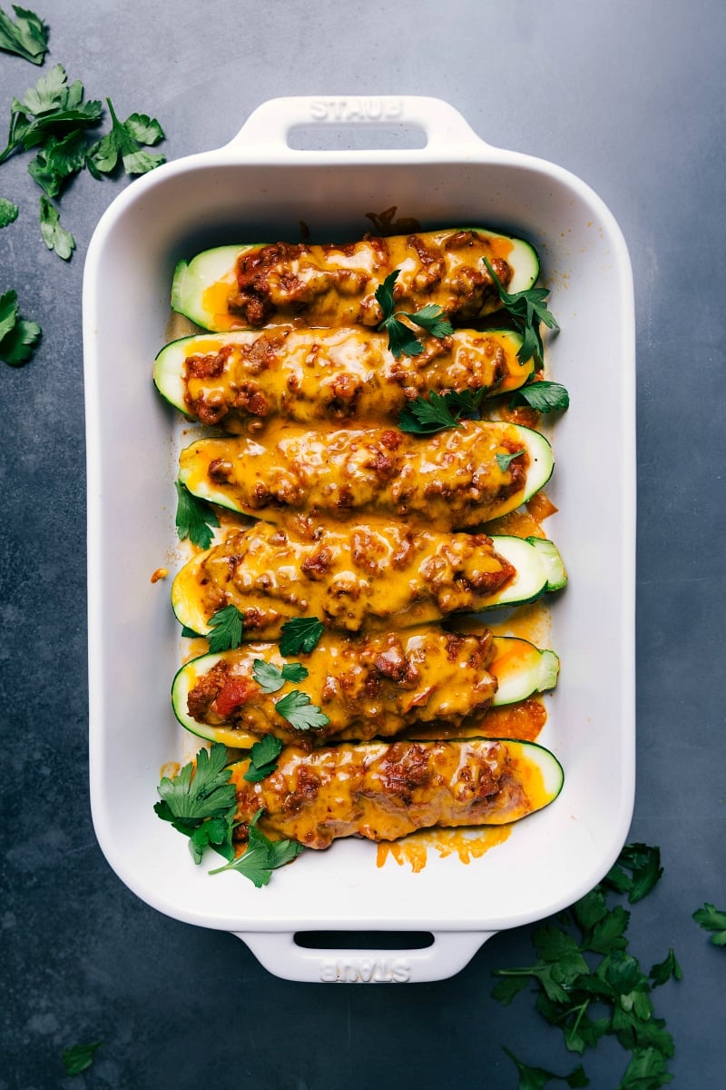 Mouthwatering Zucchini Boats with Meaty Sauce and Melted Cheese, Hot from the Oven Freshly baked zucchini boats, topped with a delicious meaty sauce and melted cheese, straight out of the oven.