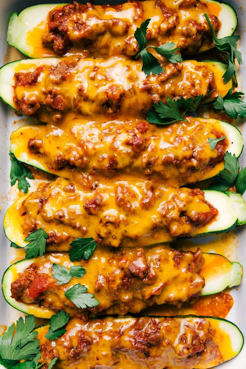 Mouthwatering Zucchini Boats with Melted Cheese - Just Baked Zucchini boats fresh out of the oven, topped with melted cheese, showcasing the finished recipe.