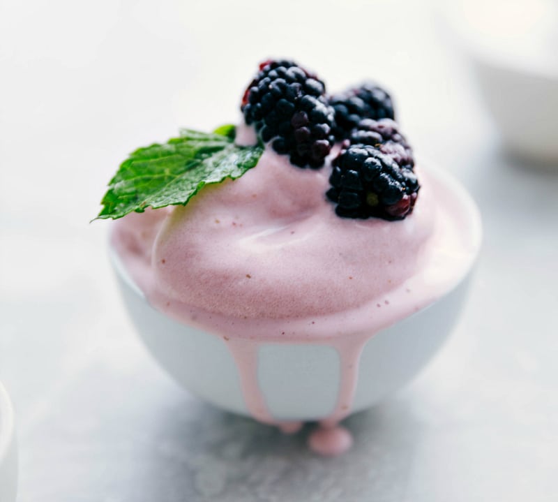Jazz up the Strawberry Frozen Yogurt with lots of add ins! Recipe via chelseasmessyapron #dessert #quick #easy #simple #best #healthier #icecreammaker #strawberry #frozen #yogurt Strawberry Frozen Yogurt with berries.