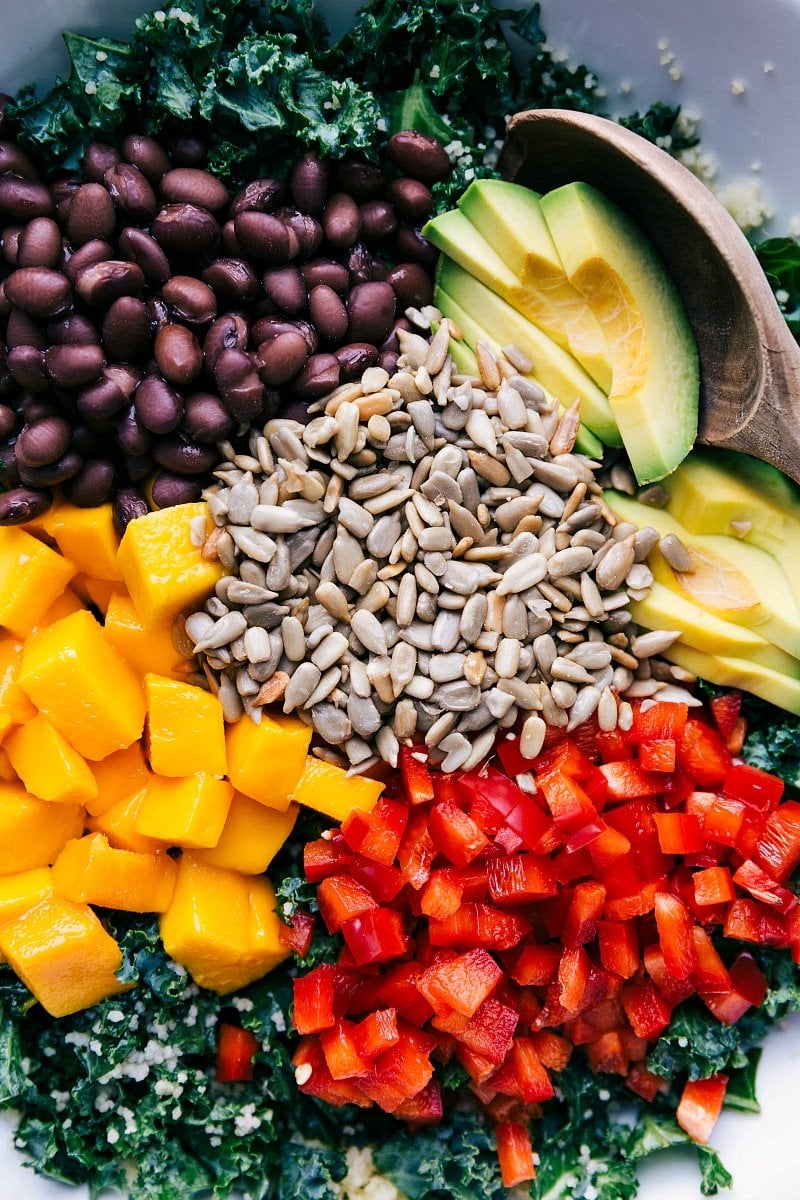 Organized View of Ingredients for Kale Couscous Salad Dish full of the vibrant ingredients, unmixed.
