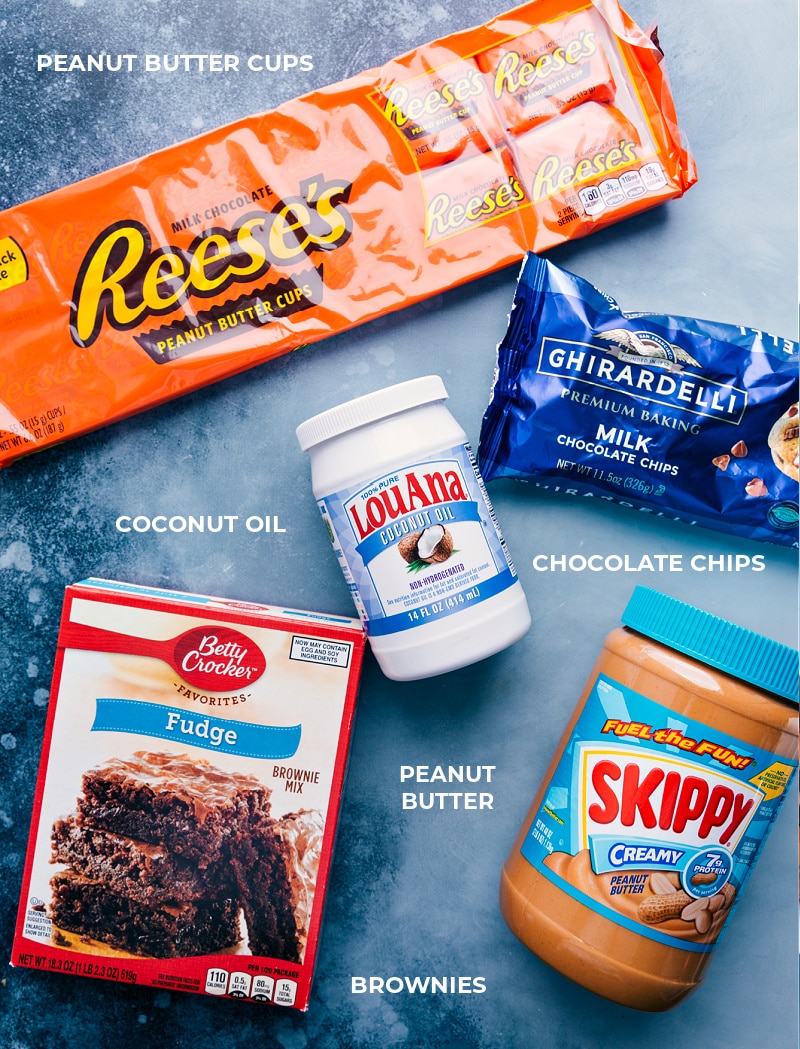 These indulgent Peanut Butter Cup Brownies combine a soft, gooey brownie base and then we press peanut butter cups into it. Top it all with a thick, fudge-like layer of peanut butter and chocolate and you've got a show stopper of a dessert! Recipe via ChelseasMessyApron #dessert #best #quick #easy #simple #chocolate #indulgent #reeses #boxbrownies #peanutbutter #cup #brownies Ingredients shot-- the ingredients that go in this dessert