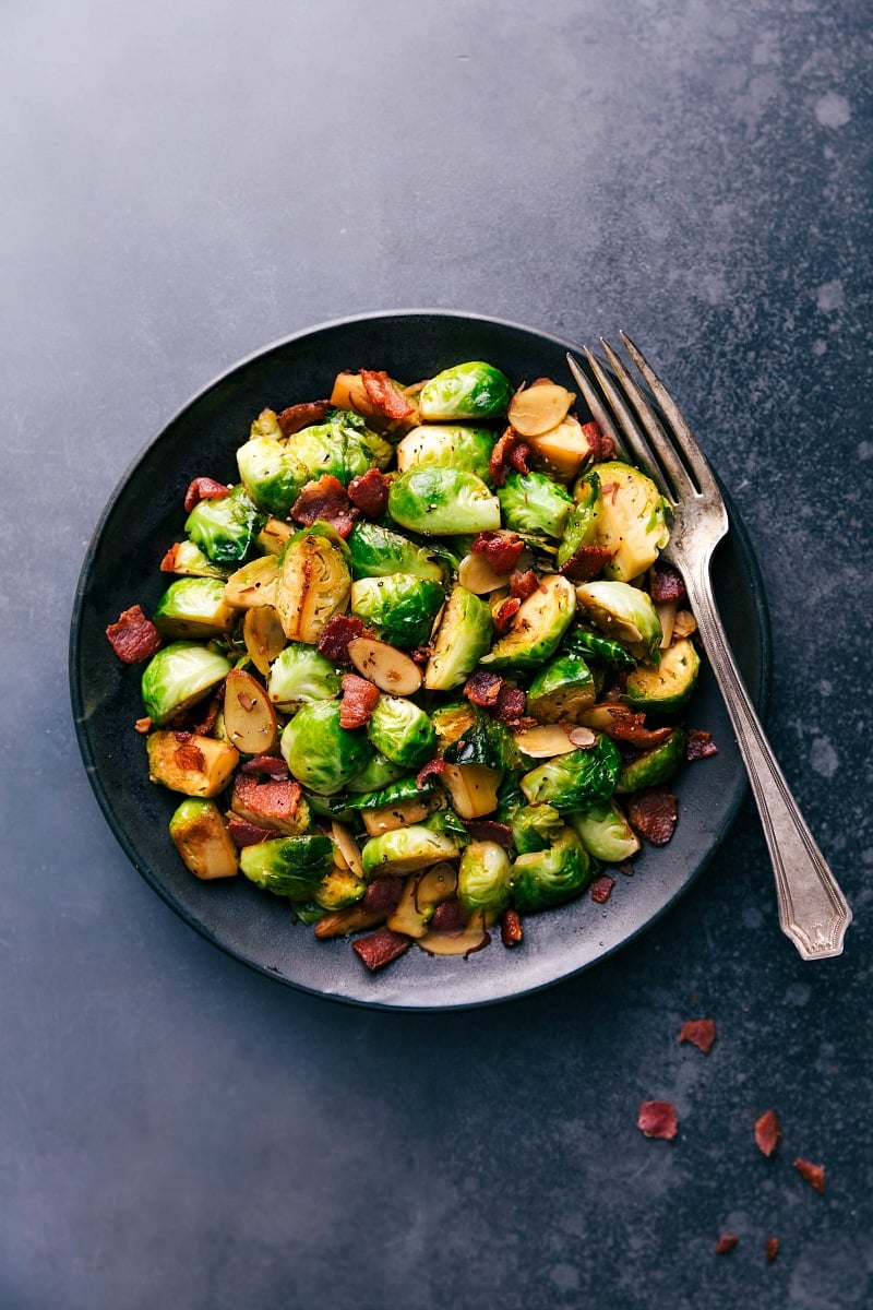 Perfectly Cooked Brussels Sprouts and Bacon Ready to Enjoy Brussels sprouts and bacon on a plate, cooked to perfection and ready to be enjoyed.