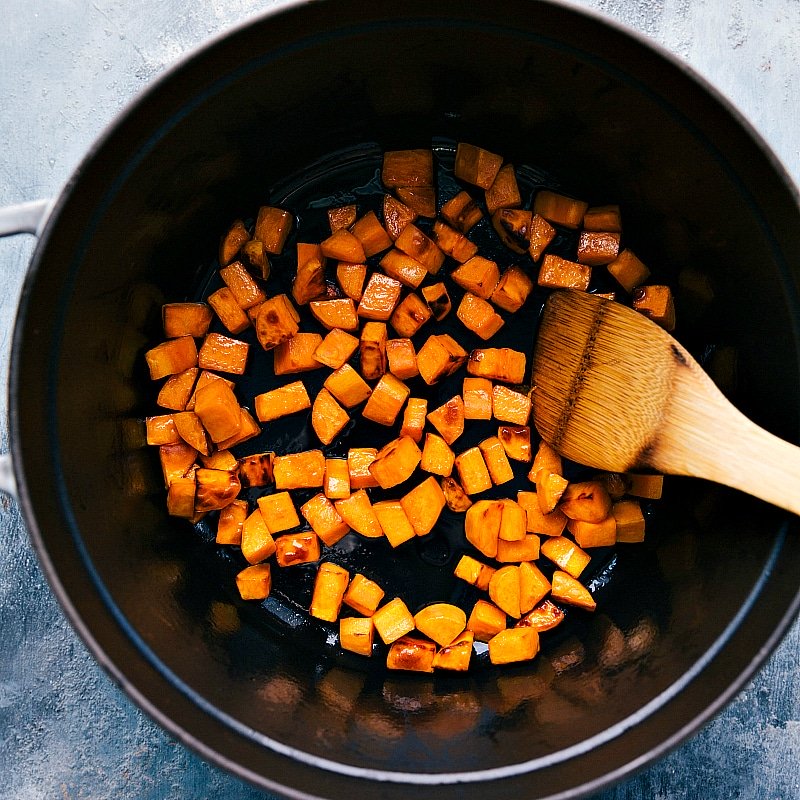 Cooking Sweet Potatoes for Sweet Potato Quinoa Chili - A Vital Step in the Recipe Sweet potatoes cooking in a pot, a key step in the preparation of sweet potato quinoa chili.