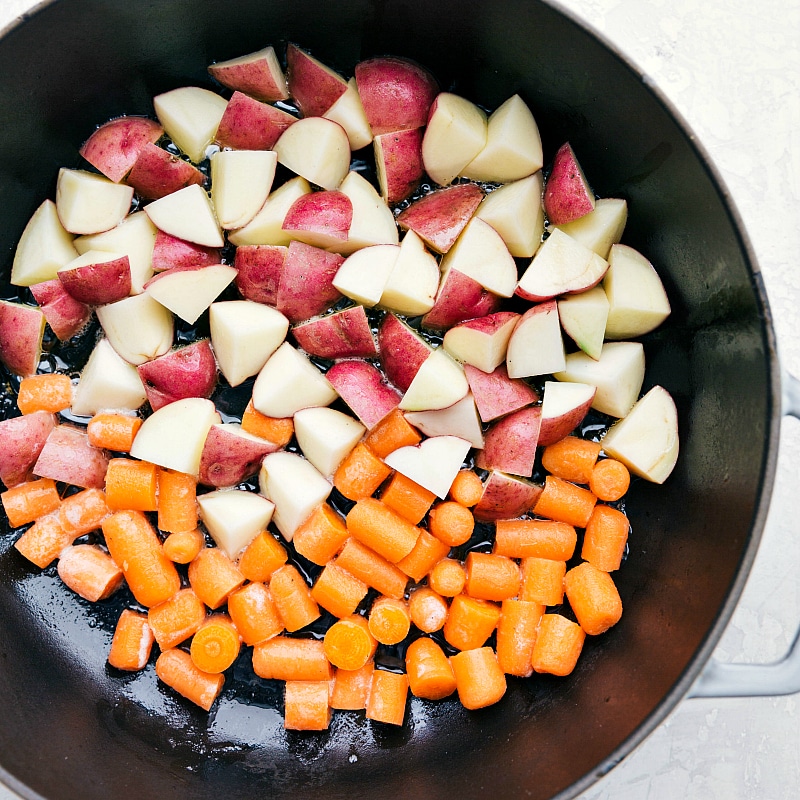 A healthy, fresh, and flavorful one skillet meal - Lemon Chicken, Red Potatoes, and Carrots. Potatoes and carrots in a skillet