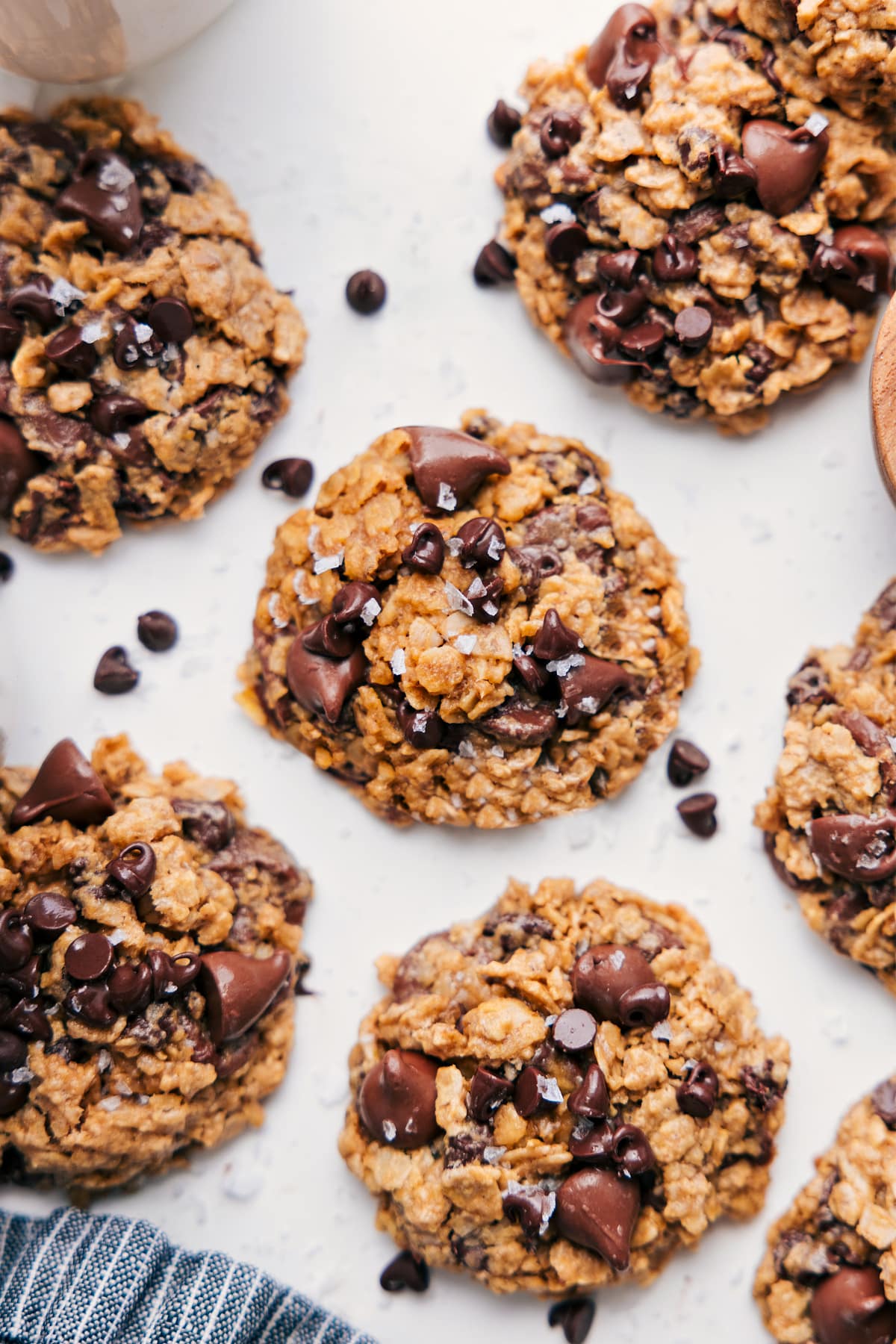 Healthy Oatmeal Chocolate Chip Cookies fresh out of the oven topped with flaky sea salt.