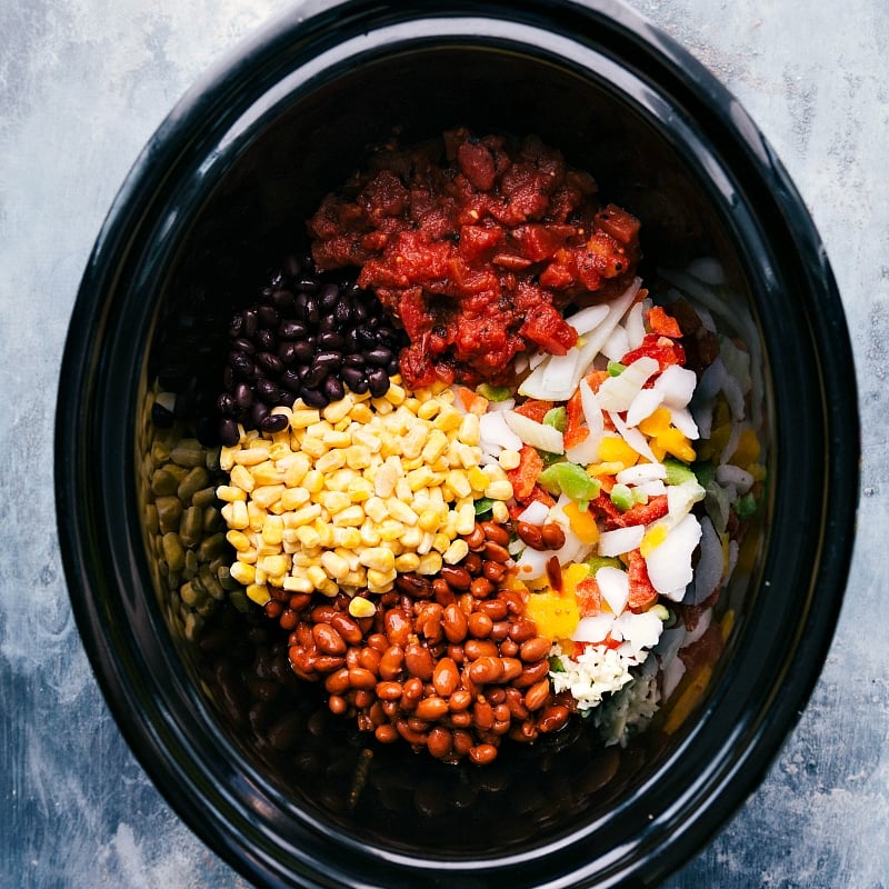 Crockpot Quinoa dish! Throw everything (uncooked) into a slow cooker and forget about it as the appliance works its magic! (Vegetarian recipe.) Recipe via ChelseasMessyApron #dinner #quick #easy #simple #best #healthy #avocado #cilantro #crockpot #quinoa Crockpot Quinoa ingredients
