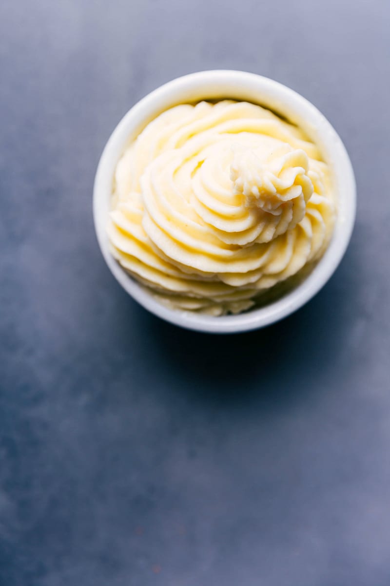 Sweet Indulgence: Ready-to-Enjoy Homemade Dole Whip in a Bowl Bowl of homemade dole whip, fluffy and sweet, tempting the taste buds.