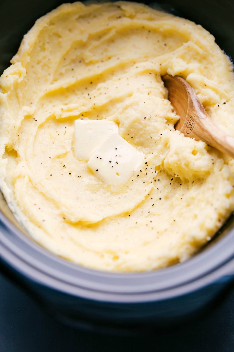 Ready-to-Enjoy Crockpot Mashed Potatoes with Butter Topping The finished crockpot mashed potato recipe topped with a dollop of butter, ready to be enjoyed.
