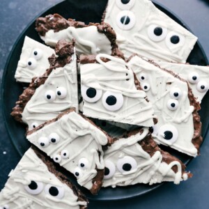 A plate displaying mummy bark, a cute and delicious festive treat, perfect for Halloween or other special occasions.
