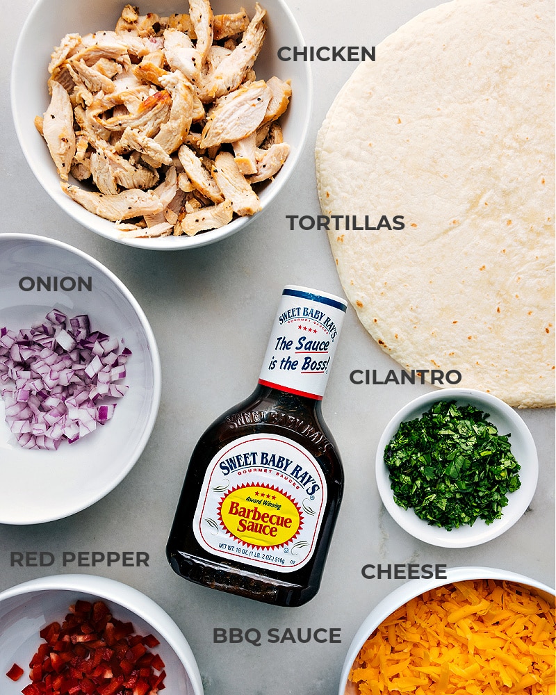 These quick and easy BBQ Chicken Wraps are a delicious combination of saucy rotisserie chicken, sharp Cheddar cheese, and a mix of fresh veggies. They're not only absolutely delicious, but also a convenient meal that can be whipped up in no time! Recipe via chelseasmessyapron #dinner #quick #easy #simple #familyfriendly #kidfriendly #bbq #chicken #wraps Image of the ingredients used in this dish