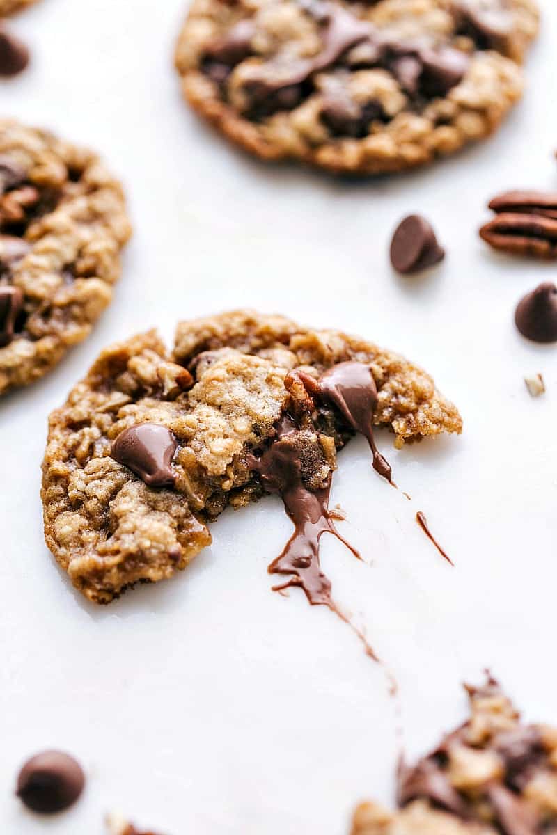 Oatmeal Chocolate Chip Pecan Cookies - Gooey Chocolate Center Revealed Oatmeal chocolate chip pecan cookies split in half to reveal the gooey chocolate center.