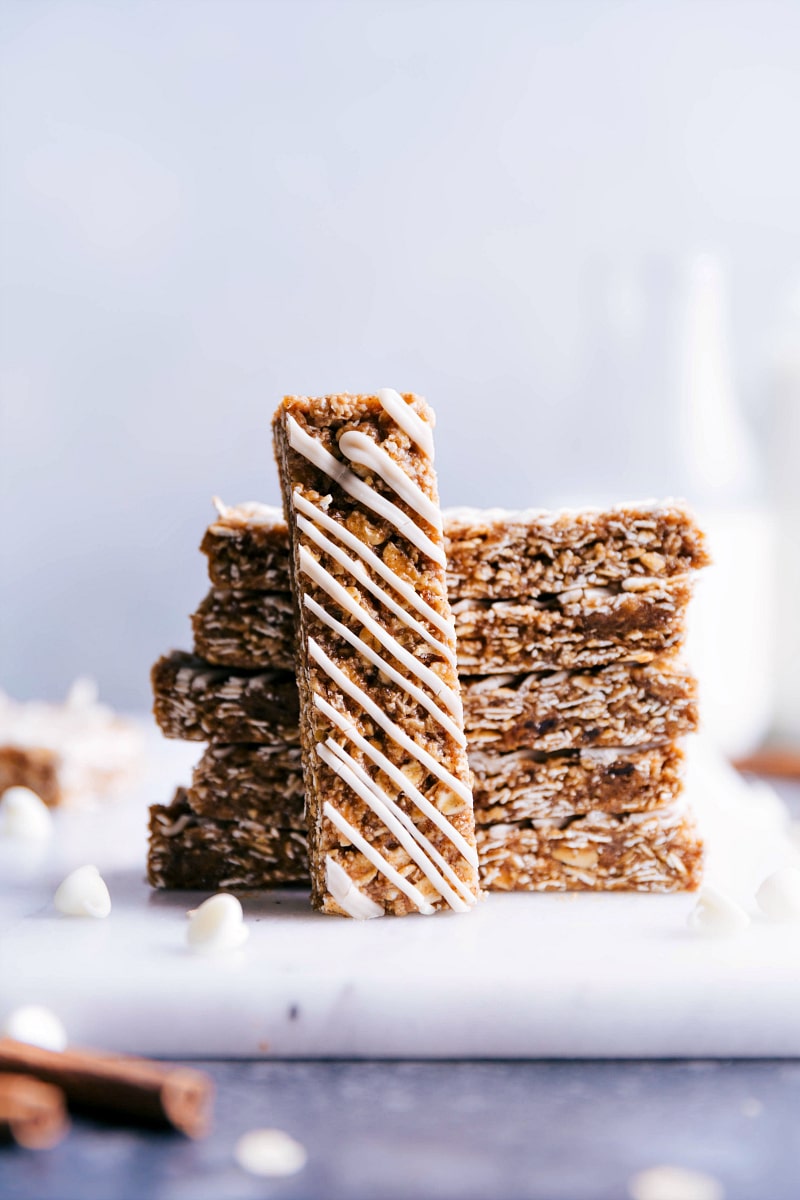 These Oatmeal Granola Bars are made to taste like an iced oatmeal cookie! Recipe via ChelseasMessyApron #quick #easy #snack #best #simple #glaze #oats #healthy #kidfriendly #oatmeal #granola #bars Oatmeal Granola Bars showing the glazed top