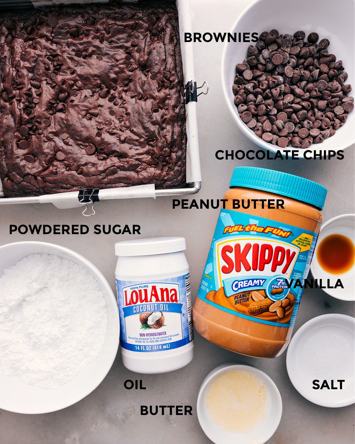 Ingredients In Buckeye Brownes This recipe includes a base, chocolate chips, peanut butter, sugar, vanilla, oil, and butter.