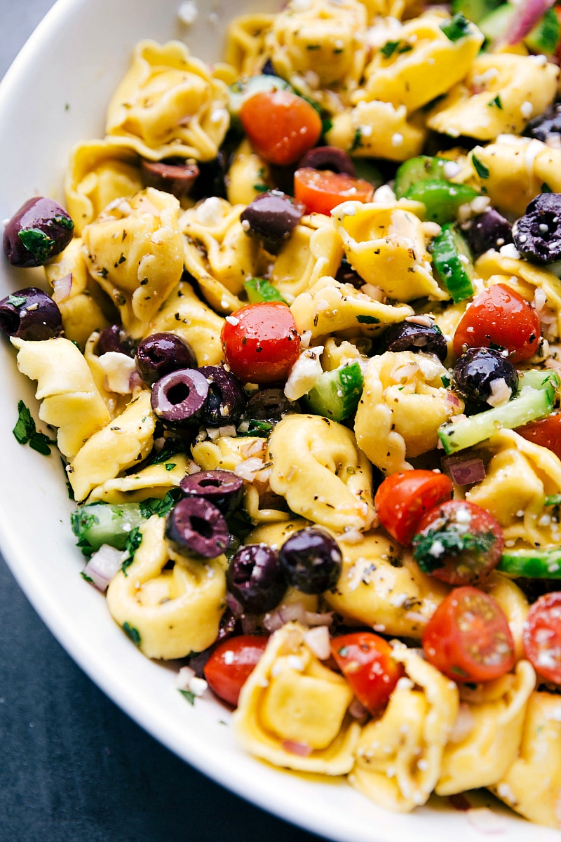 Ready-to-Eat Greek Salad with Tortellini and Dressing Finished side dish delicious, and ready to be enjoyed.