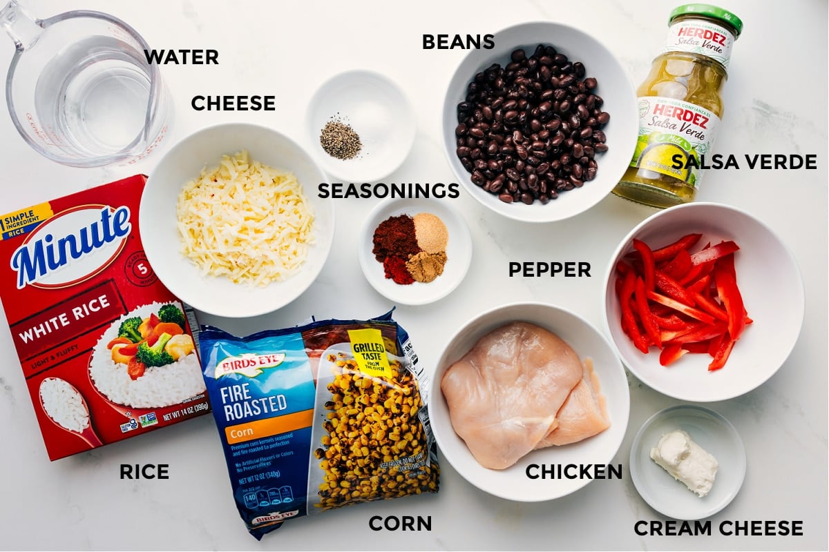 Ingredients Chicken Rice Foil Packs All the ingredients prepped and ready for easy assembly, including water, rice, cheese, corn, spices, beans, chicken, salsa verde, cream cheese, and peppers.