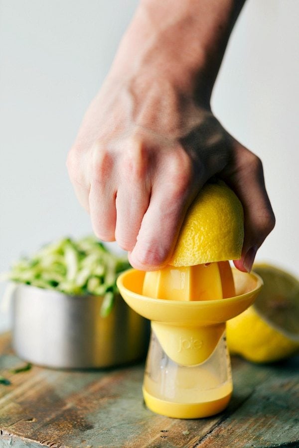 Extracting Fresh Lemon Juice - Zesty Flavor A lemon being squeezed to extract fresh juice.