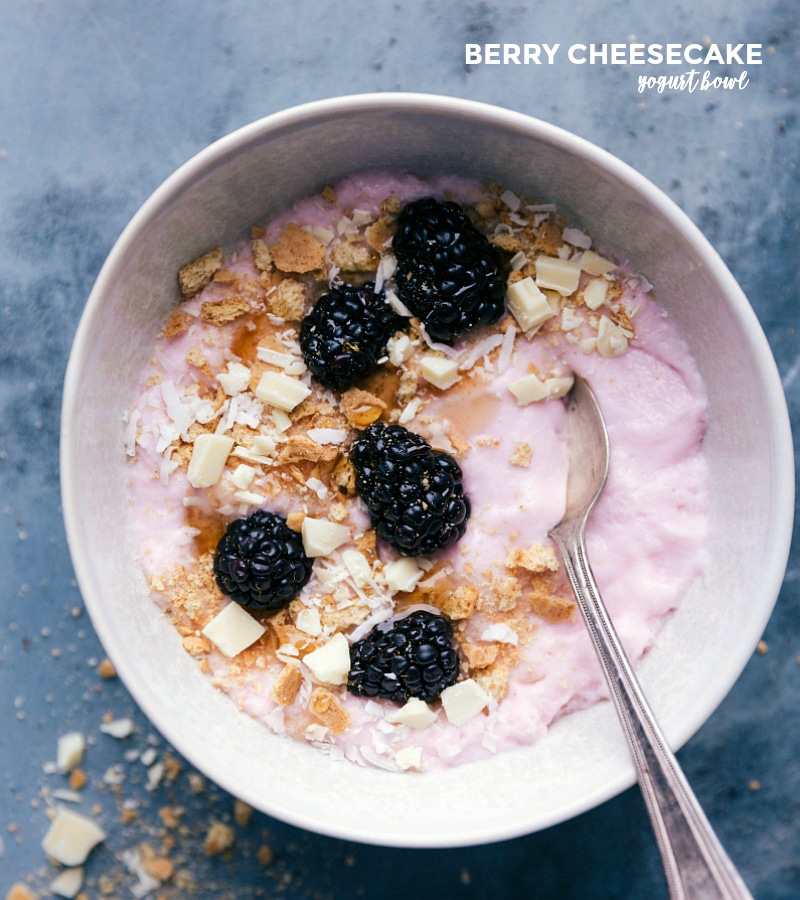 Berry Cheesecake Yogurt Bowl: A Tempting Blend of Blackberries, Graham Crackers, and White Chocolate Berry cheesecake variation featuring fresh blackberries, crumbled graham crackers, and chopped white chocolate.