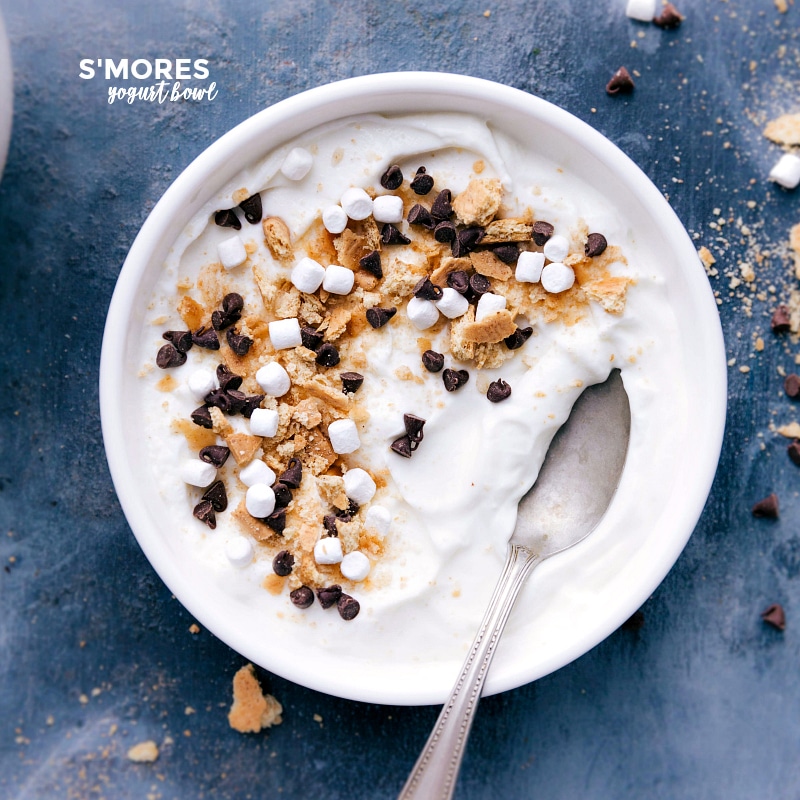 S'mores Yogurt Bowl: A Scrumptious Mix of Graham Cracker, Marshmallows, and Chocolate Chips S'mores variation adorned with crumbled graham crackers, mini marshmallows, and mini chocolate chips, ready to indulge.