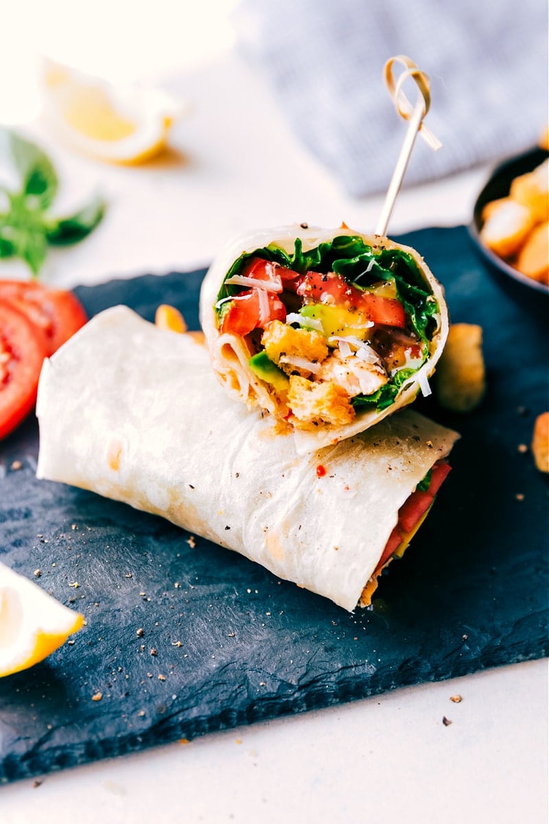 Italian Wraps are the tastiest and quickest meal to assemble! Load tortillas with crisp lettuce, sweet tomatoes, creamy avocado, seasoned rotisserie chicken, freshly grated Parmesan cheese, Italian dressing, and -- wait for it -- crunchy croutons! Italian Wraps