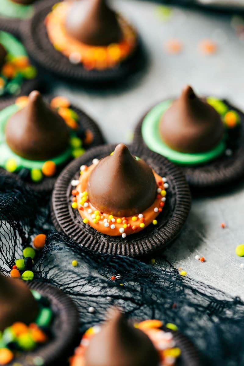 Looking for Easy Halloween Treats? We've got you covered! With just four ingredients or less, you can make Monster Eyeballs, Witches Hats, Witches Brooms, and Bat Bites. Simple, tasty, and no baking needed! Let's get this Halloween party started! Recipe via chelseasmessyapron #dessert #best #quick #simple #treat #spooky #easy #halloween #treats Image of the Easy Halloween Treats-- witch hats on a board
