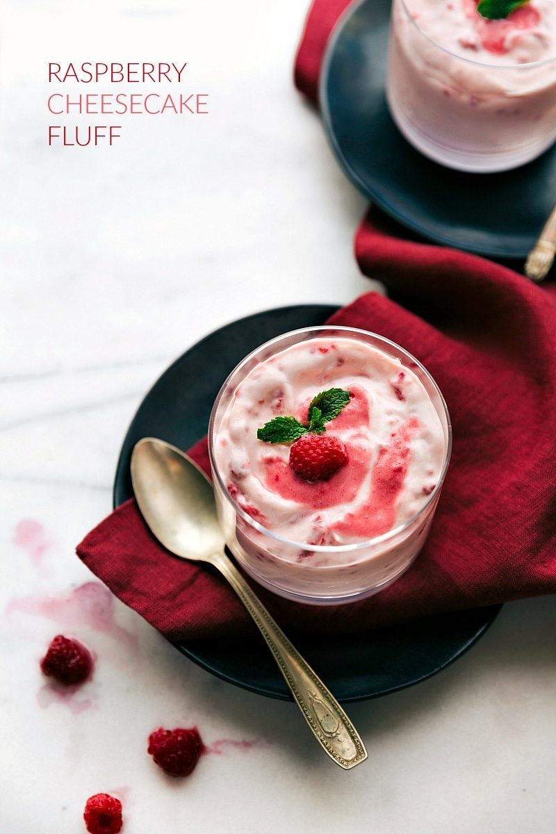 Raspberry Fluff is a simple dessert salad made with only four ingredients with only about ten minutes of prep time! Recipe via chelseasmessyapron #salad #saladcoolwhip #dessert #coolwhip #saladrecipes #withyogurt #recipes #thanksgiving #christmas #easter #raspberry #fluff Overhead image of the raspberry fluff in a cup