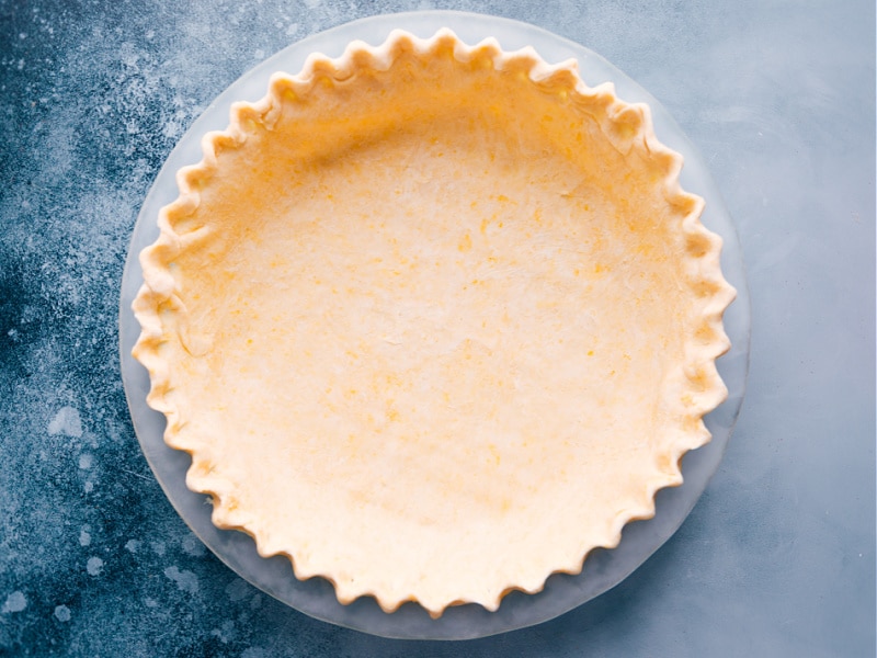 The Best Pie Crust Recipe The crust in a glass pan, ready for baking.