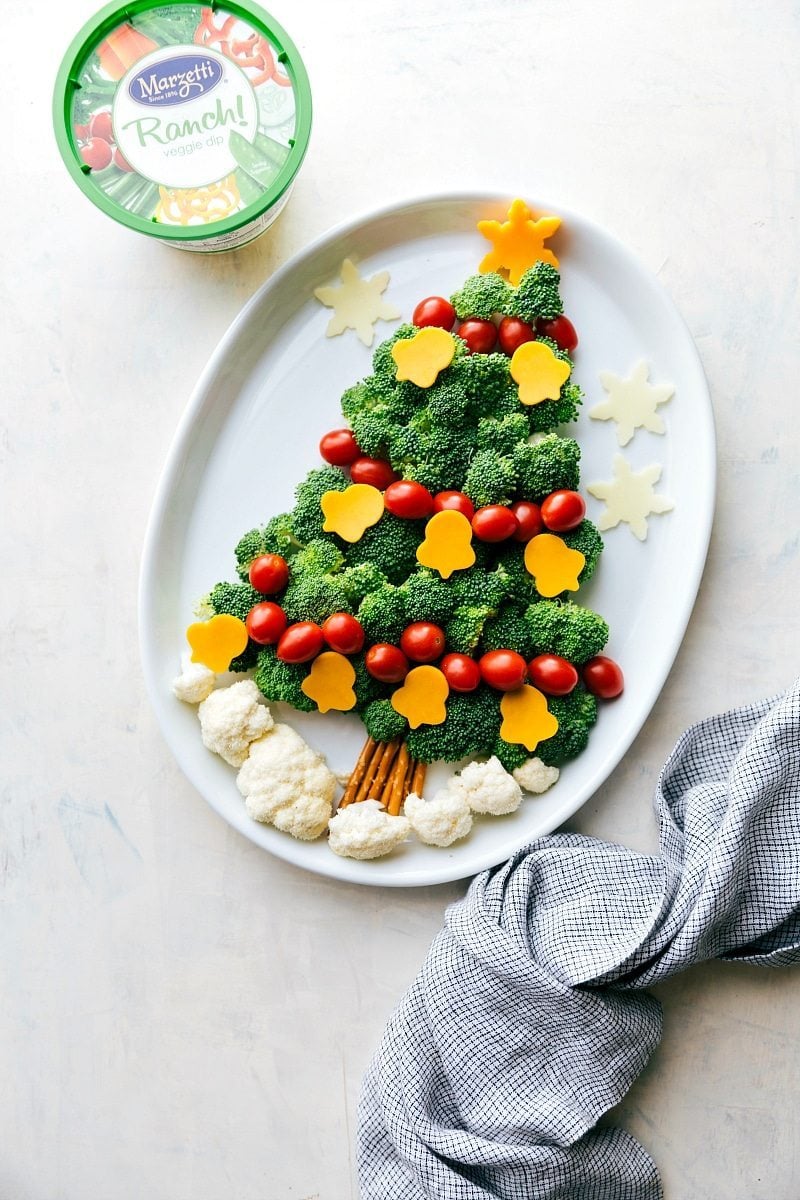 Christmas Tree Veggie Dip Recipe Vegetables arranged in the shape of a Christmas tree with veggie dip for a festive holiday snack.