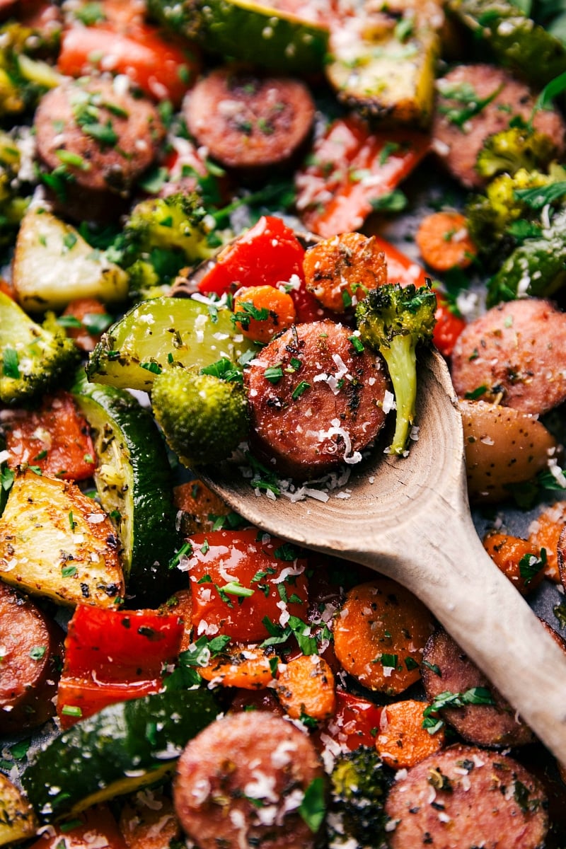 Spoonful of One-Pan Italian Sausage and Veggies A spoonful of the finished meal, showcasing a bite full of flavor and texture, ready to be enjoyed.
