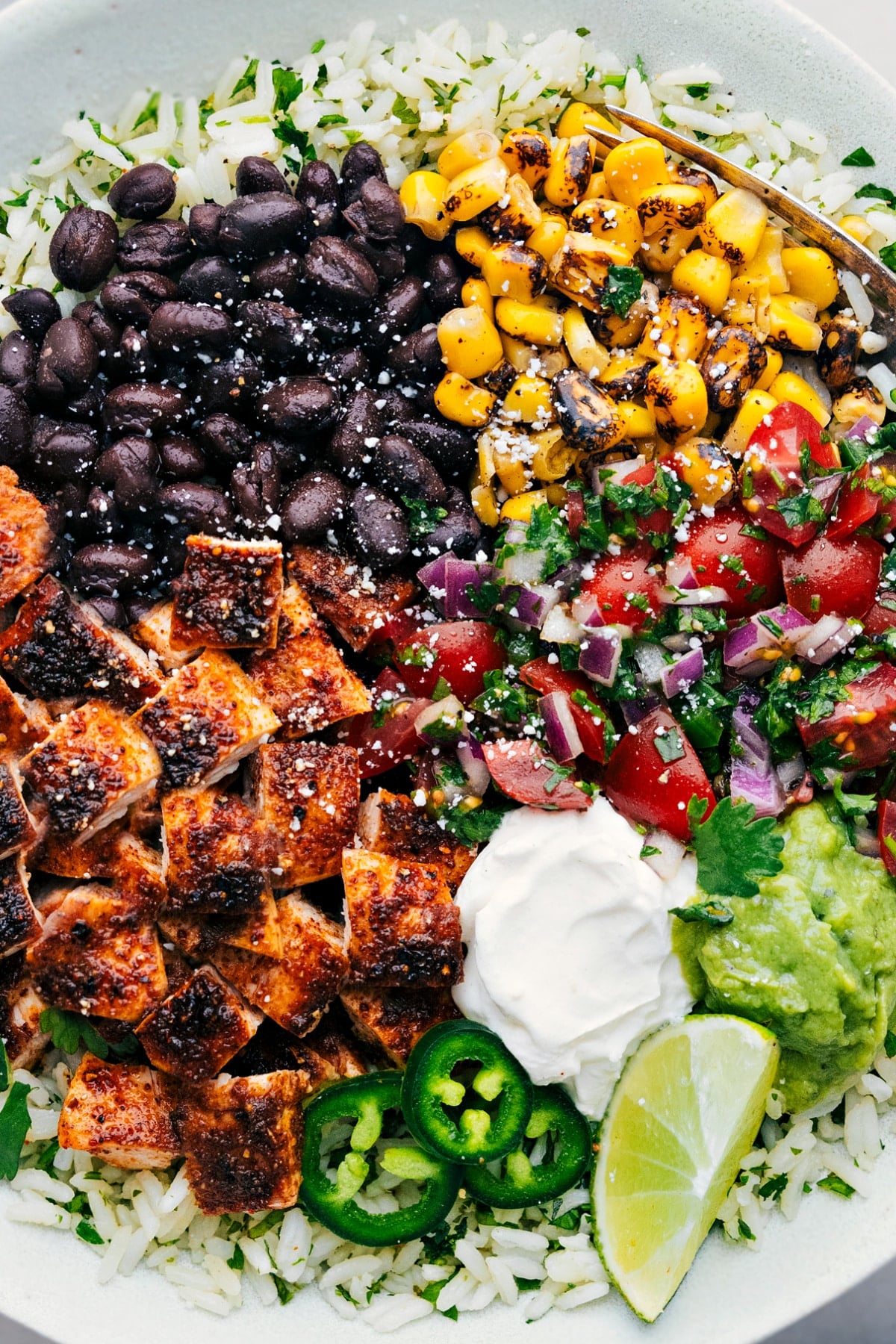 Our Favorite Chicken Burrito Bowls Chicken Burrito Bowls with all the toppings.