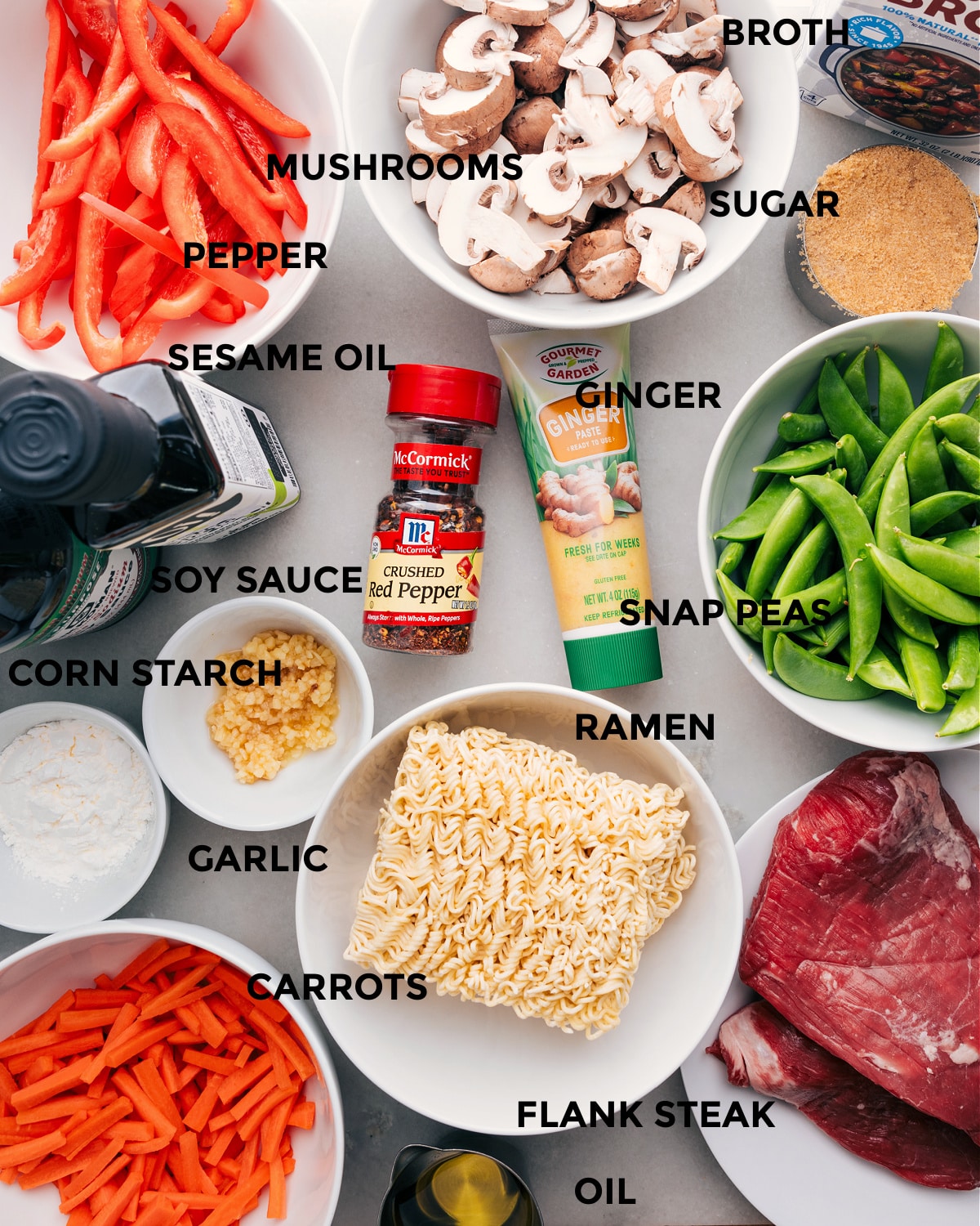 Ingredients In Garlic Beef And Veggie Ramen Recipe All the ingredients for this recipe, including the veggies, broth, sugar, noodles, cornstarch, garlic, seasonings, and meat, are prepped for easy assembly.