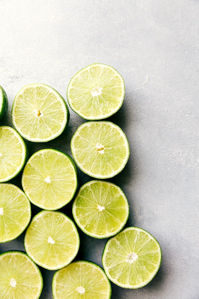 CHERRY LIME SPRITZER! An easy to make and tasty mocktail via chelseasmessyapron.com #cherries #spritzer #tartcherries #mocktail #alcoholfree #refreshing View of halved fresh limes