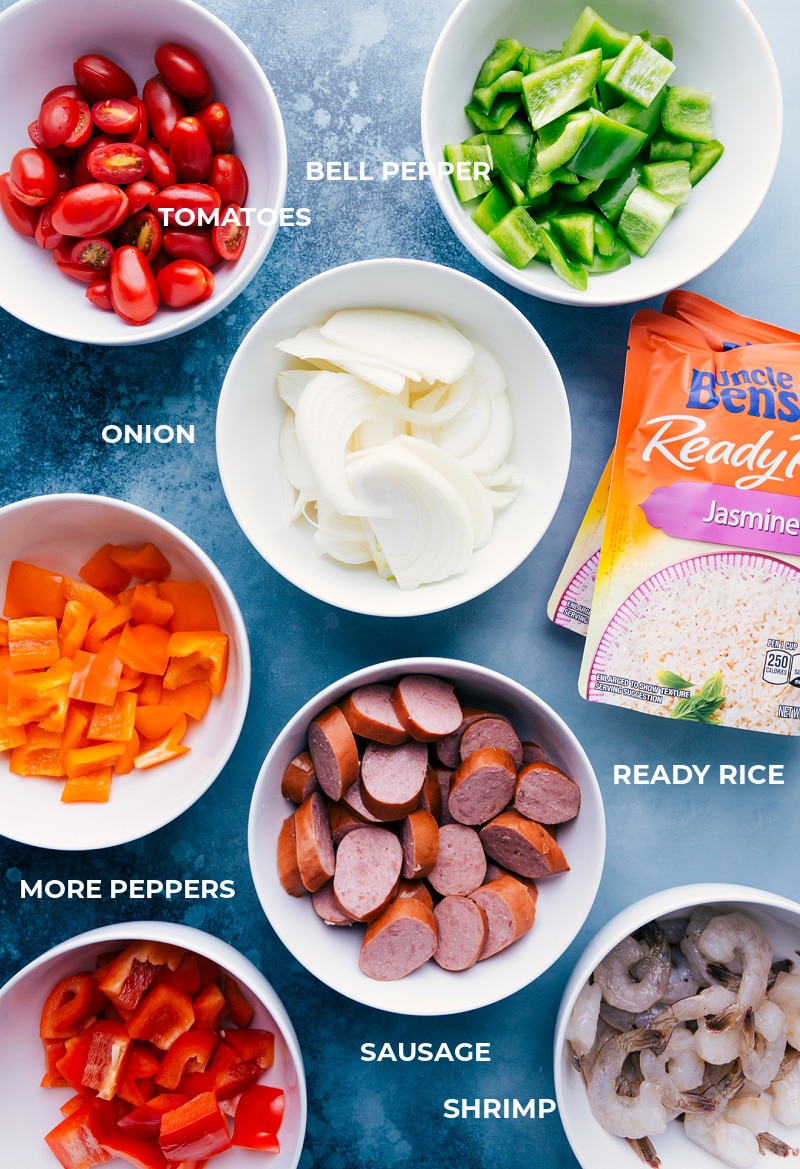 One-Pan Jambalaya is an easy, nutritious, 30-minute meal of oven-roasted & seasoned sausage, shrimp, veggies, and rice. Recipe via ChelseasMessyApron #dinner #quick #easy #simple #best #veggies #shrimp #sausage #rice #onepan #jambalaya Ingredient shot: elements that go into this One-Pan Jambalaya recipe