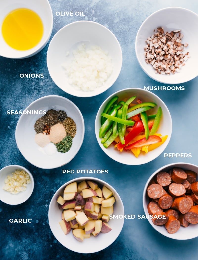 These delicious Foil Pack Italian Sausage and Veggieย meals combine smoked sausage, sweet bell peppers, savory mushrooms, tender potatoes, minced garlic, and diced yellow onions with olive oil and an incredible Italian-inspired seasoning blend. Ingredient shots-- all the ingredients used in this meal