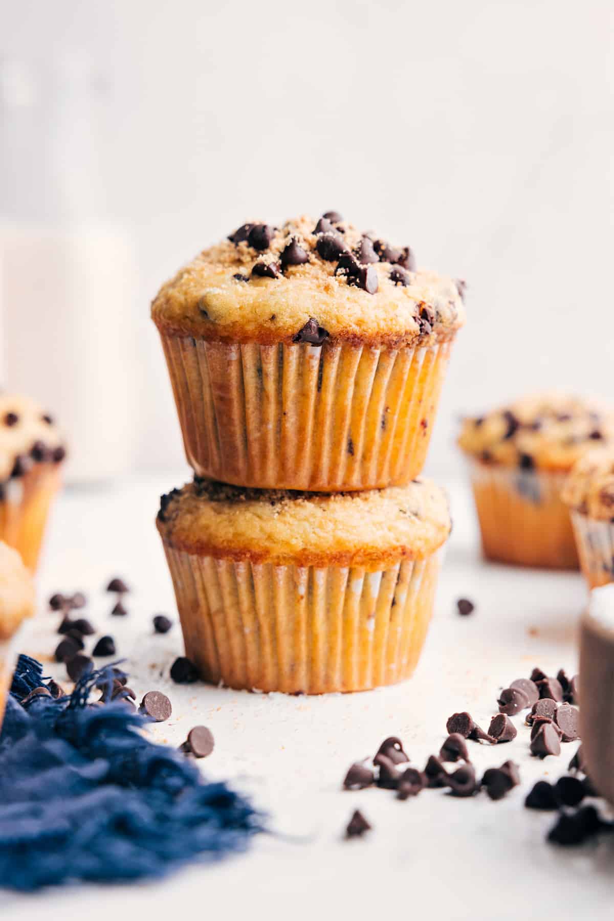 These tender Healthy Chocolate Chip Muffins are made with better-for-you ingredients without sacrificing flavor or texture! They're moist, soft, and every bite is studded with miniature chocolate chips! Recipe via ChelseasMessyApron #dessert #breakfast #quick #easy #simple #treat #snack #milk #healthy #chocolate #chip #muffins