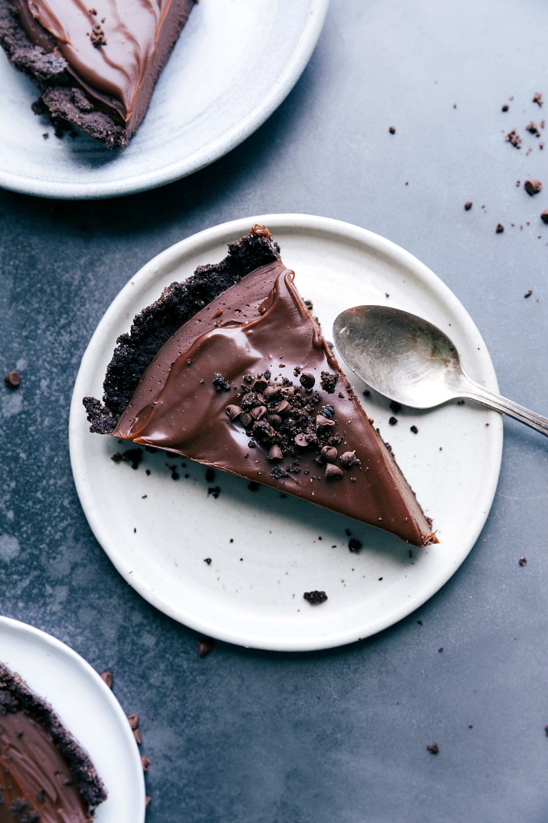 Slice of Chocolate Tart with Oreo Crumbs - Ready to Savor A slice of chocolate tart, a mouthwatering dessert topped with oreo crumbs, ready to be savored.