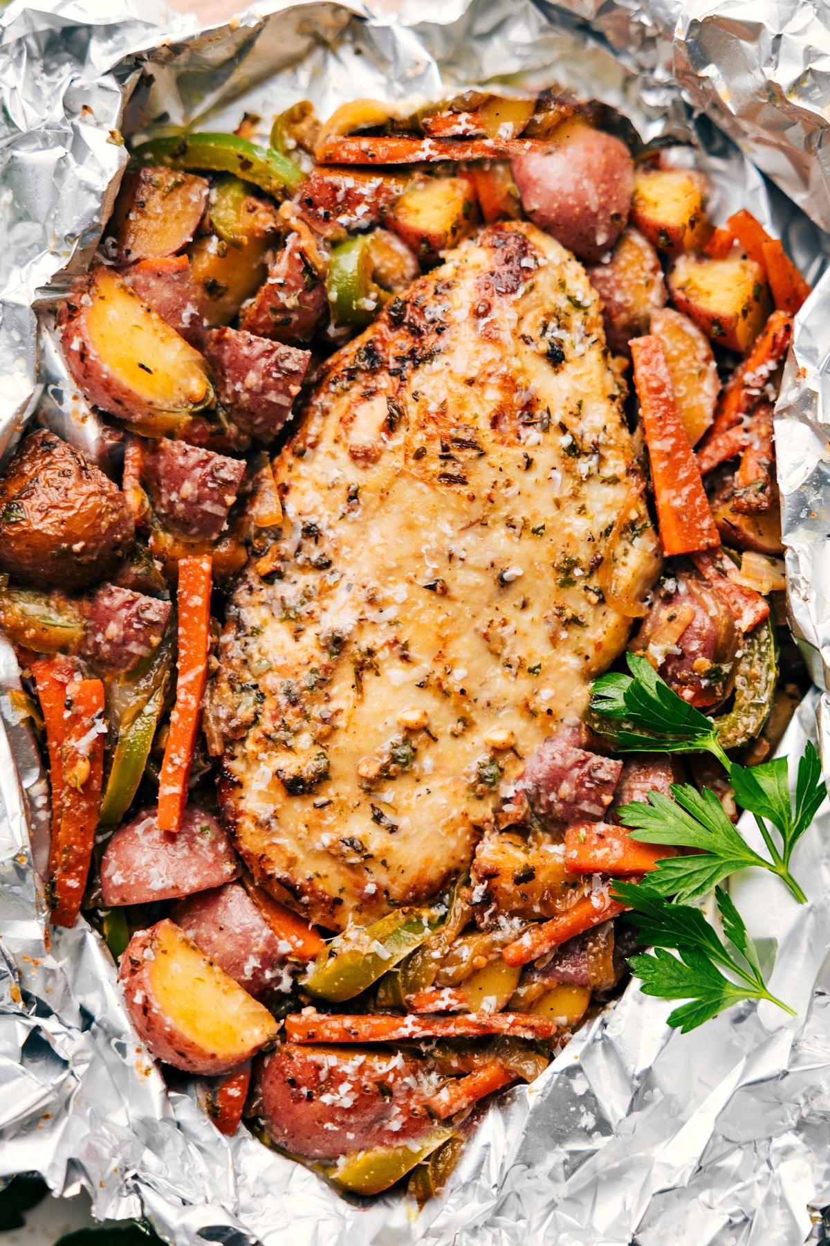 Foil Pack Italian Chicken and Veggies fresh out of the oven ready to be enjoyed.