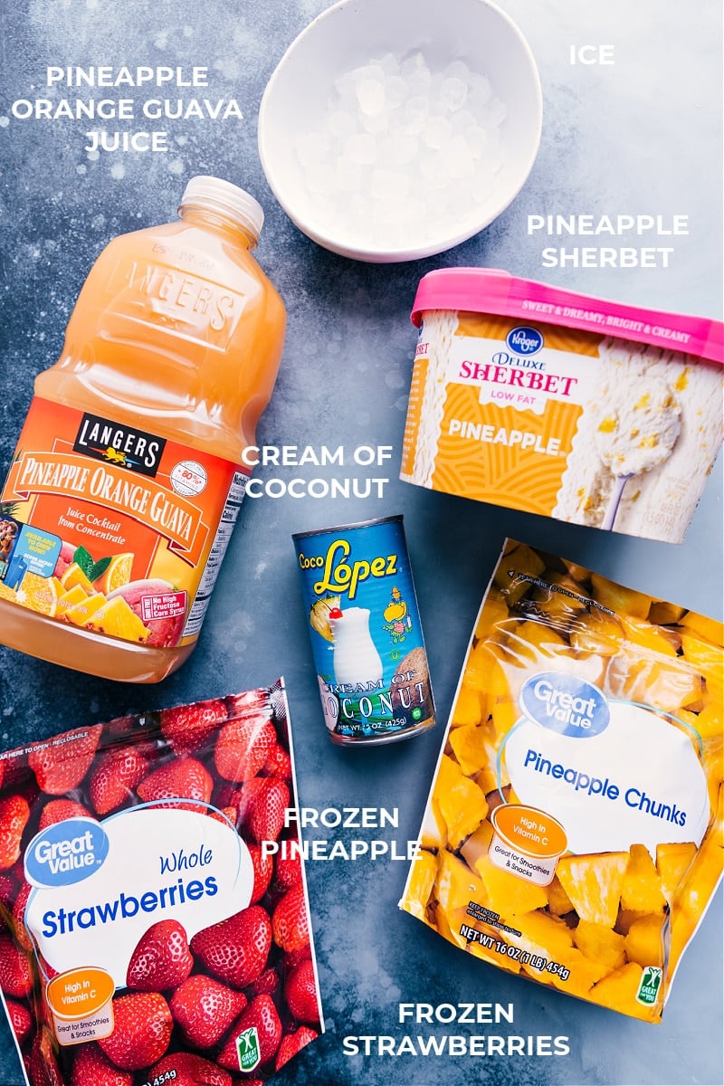 Strawberry Piña Colada smoothie is a creamy, sweet, frozen drink with coconut, pineapple, and strawberries. Adding strawberries makes for a fun and unique take on the classic frozen Pina Colada. (This beverage is non-alcoholic.) Recipe via chelseasmessyapron #breakfast #quick #easy #simple #delicious #snack #pineapple #tropical #best #frozen #strawberry #pinacolada #smoothies All the ingredients needed to make Strawberry Piña Colada smoothies.